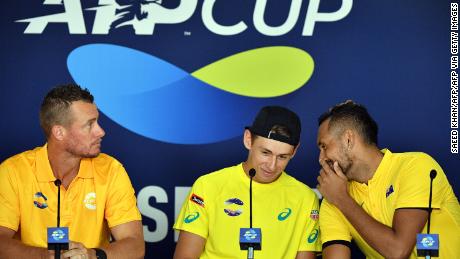 Kyrgios (right) will star for an Australian team featuring Alex de Minaur and captained by Lleyton Hewitt (left) at the ATP Cup. 