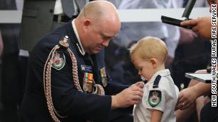 A firefighter was killed in the Australia bushfires. His son received a medal to honor his father's bravery