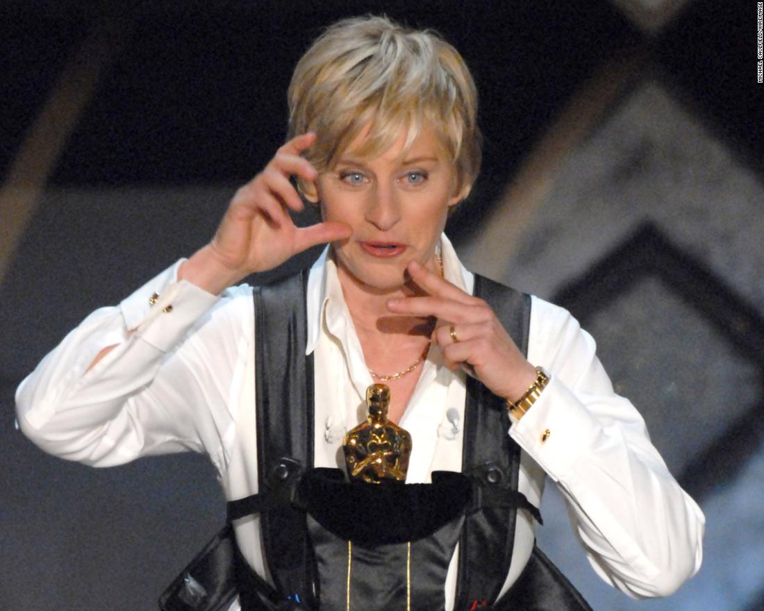 DeGeneres carries an Oscar as she hosts the Academy Awards in 2007.