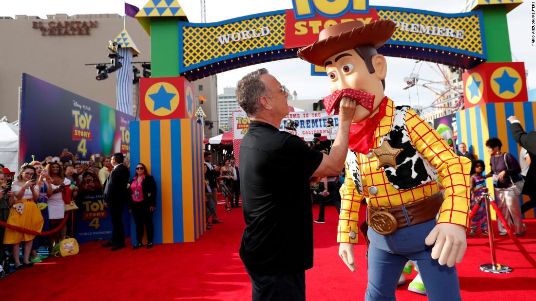 Hanks poses with his &quot;Toy Story&quot; character Woody at the premiere of &quot;Toy Story 4&quot; in June 2019.