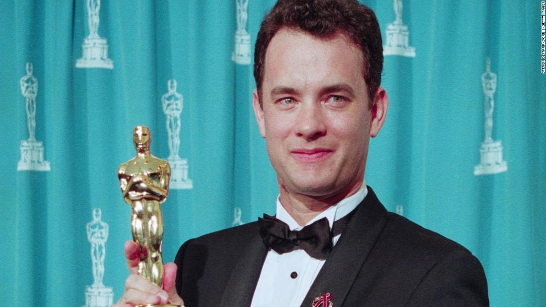 Hanks holds his Oscar at the 1994 Academy Awards.