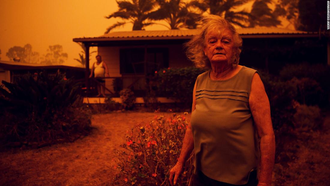 Nancy Allen stands outside her house as high winds push smoke and ash from the Currowan Fire toward Nowra in New South Wales on January 4.