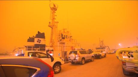 Smoke-filled orange skies over Eden, New South Wales, on December 5, 2020.