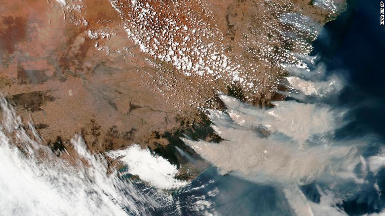 This satellite image provided by NASA on Saturday, January 4, shows smoke from fires burning in Victoria and New South Wales.