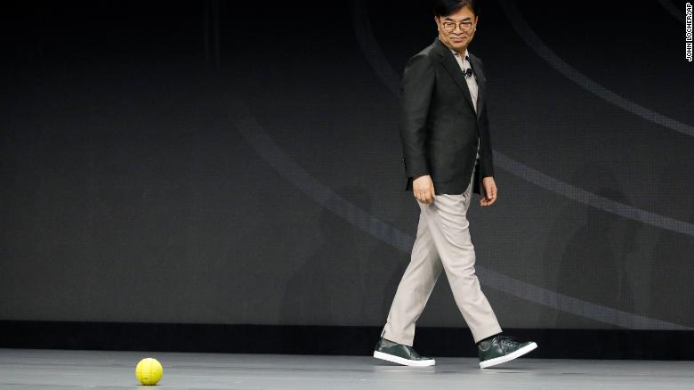 Hyun-Suk Kim, president and CEO of the Consumer Electronics Division at Samsung, demonstrates Ballie, an AI rolling robot during a Samsung keynote before the CES tech show, Monday, Jan. 6, 2020, in Las Vegas. 