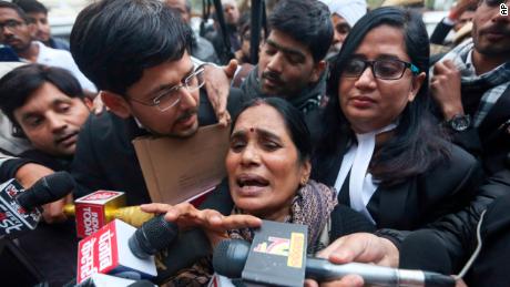 Asha Devi, mother of the victim of the fatal 2012 gang rape on a bus, leaves court in New Delhi on Tuesday, January 7.