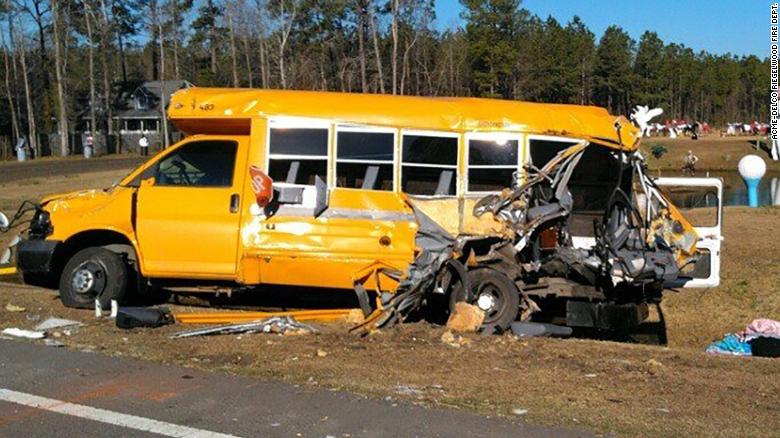 The bus was carrying eight children and two adults when it was struck by a tractor-trailer.