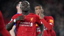 Mane (L) reacts after failing to score during the English Premier League football match between Liverpool and Everton at Anfield on December 4, 2019. 