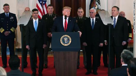 US President Donald Trump(C) speaks about the situation with Iran in the Grand Foyer of the White House in Washington, DC, January 8, 2020. 