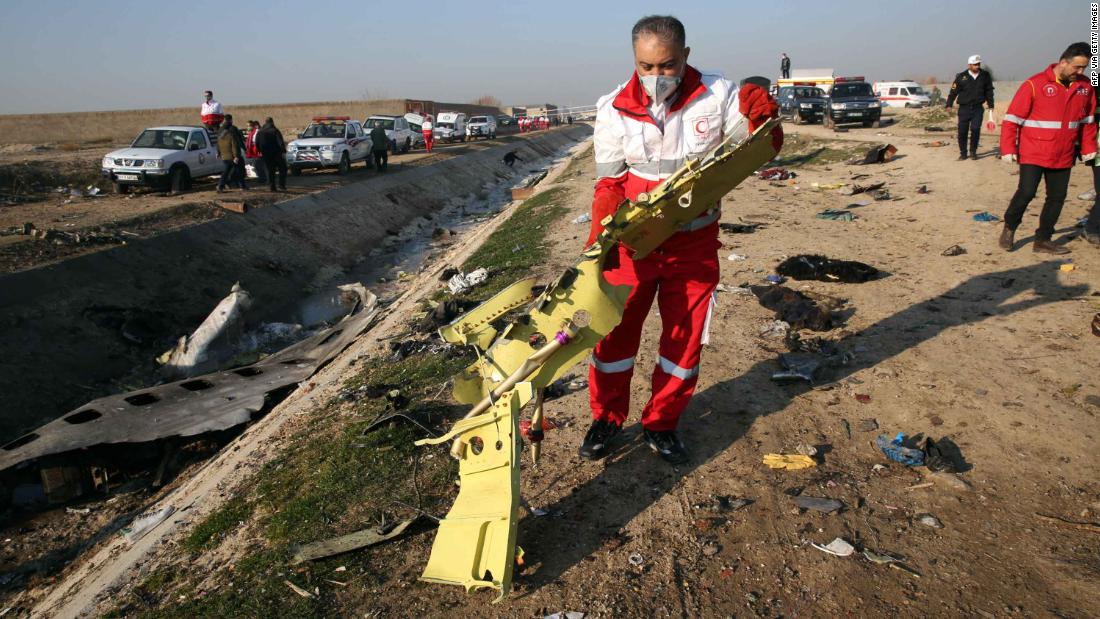 Authorities recover debris from the plane.