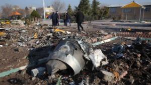 Rescue teams work amidst debris after a Ukrainian plane carrying 176 passengers crashed near Imam Khomeini airport in the Iranian capital Tehran early in the morning on January 8, 2020, killing everyone on board. - The Boeing 737 had left Tehran's international airport bound for Kiev, semi-official news agency ISNA said, adding that 10 ambulances were sent to the crash site. (Photo by - / AFP) (Photo by -/AFP via Getty Images)