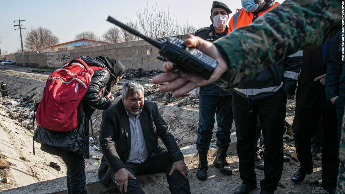 A man reacts at the crash site.