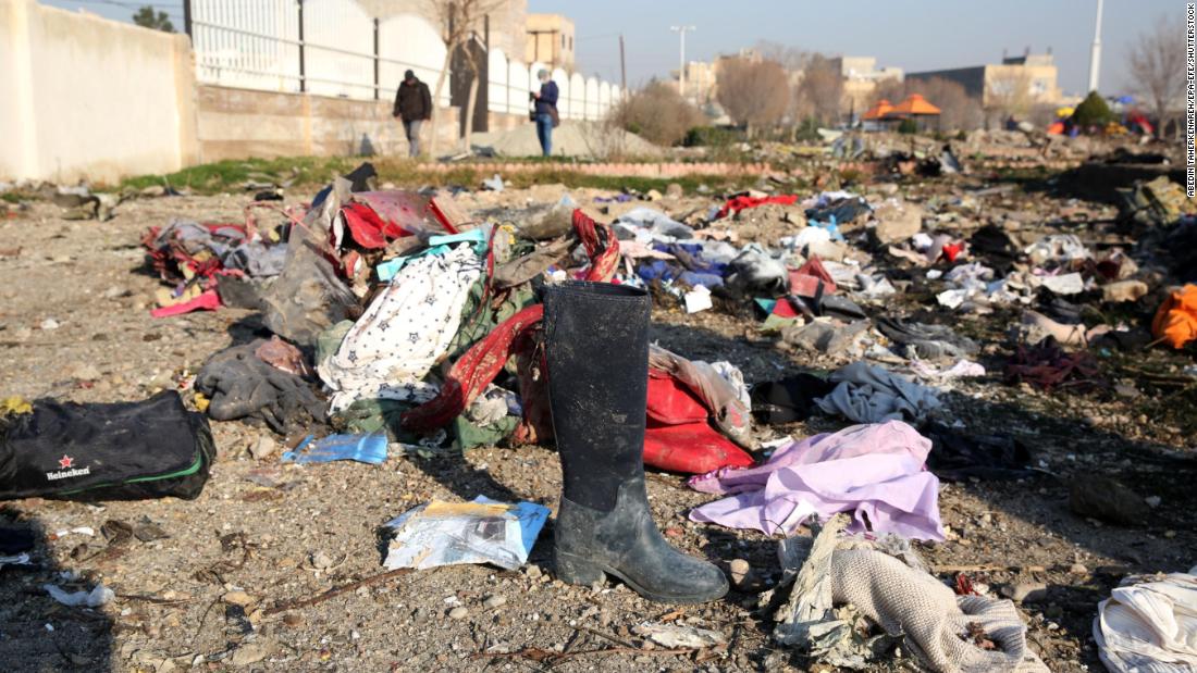 Victims' possessions are seen scattered at the crash site.