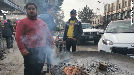 Mohammed Hammed, 30, grills fish on a sidewalk in central Baghdad. He says the Iranian strike on Wednesday was &quot;absolutely wrong.&quot;