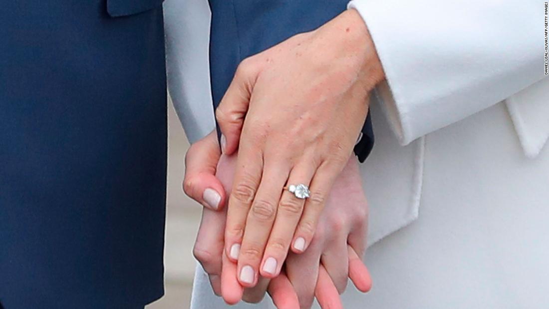 Meghan flashed her engagement ring to reporters during a November 2017 photo call. The ring, designed by Harry, featured a large diamond from Botswana and two smaller outer diamonds from the personal collection of Harry&#39;s late mother.