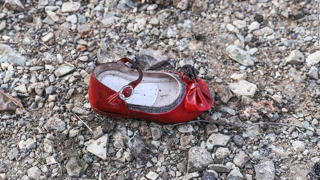 A child's shoe is pictured at the scene of the crash.