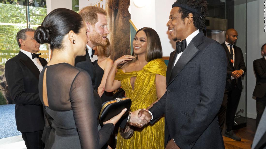 Harry and Meghan greet singer Beyoncé and her husband, rapper Jay-Z, as they attend the European premiere of the film &quot;The Lion King&quot; in July 2019.