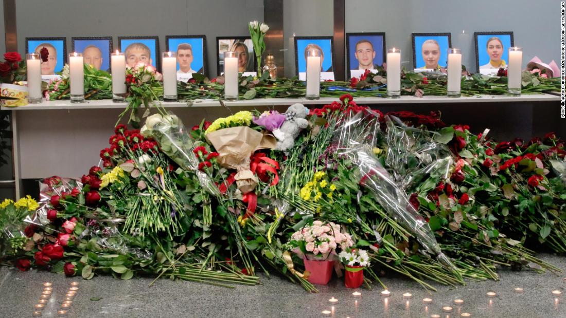 At Ukraine's Boryspil International Airport, flowers are placed at a memorial for the nine crew members who were killed in the crash.