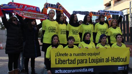 Women from Amnesty International protest outside the Saudi embassy in Madrid.