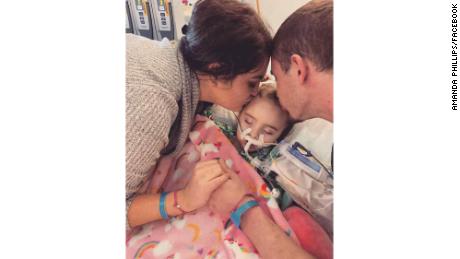 Amanda Phillips and Stephen DeLucia with their daughter, Jade DeLucia, at the University of Iowa Stead Family Children's Hospital. 