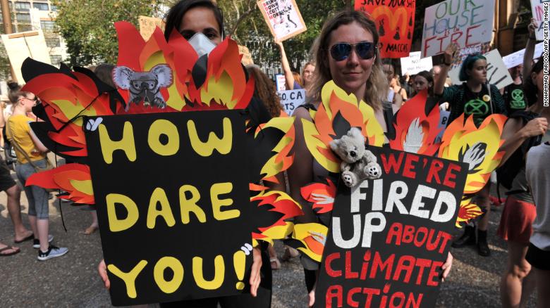 Tens of thousands of Australians rallied across cities as deadly climate-fuelled bushfires swept across the continent.