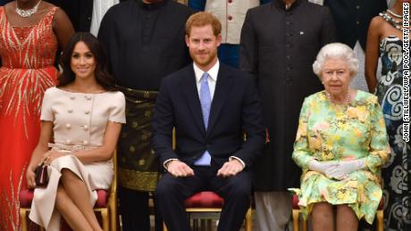 Meghan, Duchess of Sussex, Prince Harry, Duke of Sussex and Queen Elizabeth II at the Queen&#39;s Young Leaders Awards Ceremony at Buckingham Palace in June, 2018.