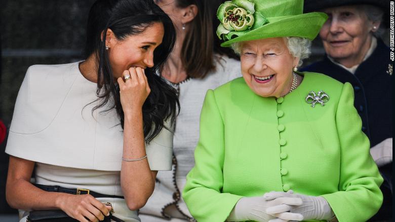  Queen Elizabeth II sitts and laughs with Meghan, Duchess of Sussex during a ceremony to open the new Mersey Gateway Bridge on June 14, 2018 in the town of Widnes in Halton, Cheshire, England. 