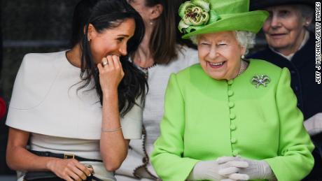 CHESTER, ENGLAND - JUNE 14:  Queen Elizabeth II sitts and laughs with Meghan, Duchess of Sussex during a ceremony to open the new Mersey Gateway Bridge on June 14, 2018 in the town of Widnes in Halton, Cheshire, England. Meghan Markle married Prince Harry last month to become The Duchess of Sussex and this is her first engagement with the Queen. During the visit the pair will open a road bridge in Widnes and visit The Storyhouse and Town Hall in Chester.  (Photo by Jeff J Mitchell/Getty Images)