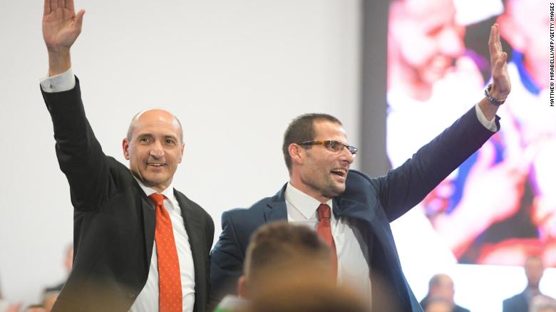 Labour Party leader candidates Chris Fearne (left) and Robert Abela (right) wave to delegates before the vote.