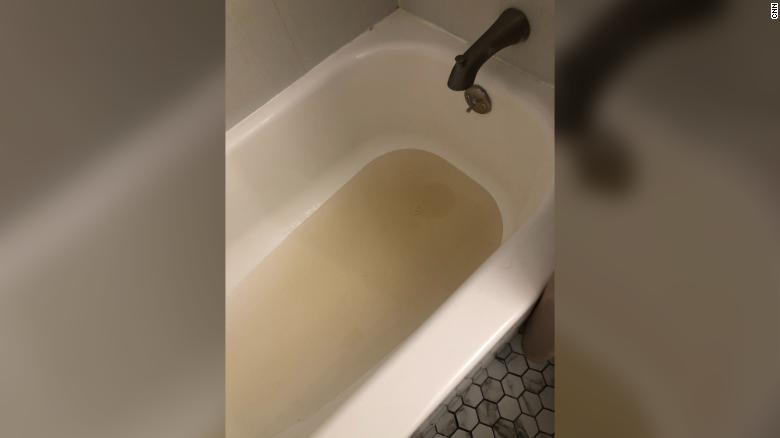 CNN employee Philip Ross reported low water pressure and tea-colored water coming out of the faucets in his apartment on Monday.