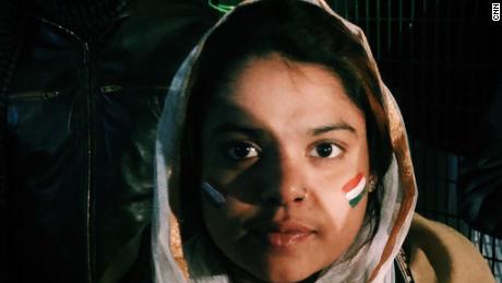 A demonstrator sports a headscarf and an Indian flag painted on her face in Shaheen Bagh, a neighborhood in the Indian capital of New Delhi, on December 27, 2019.