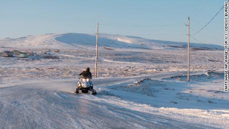 Winter conditions in Toksook Bay make snowmobiles a common form of transportation. 