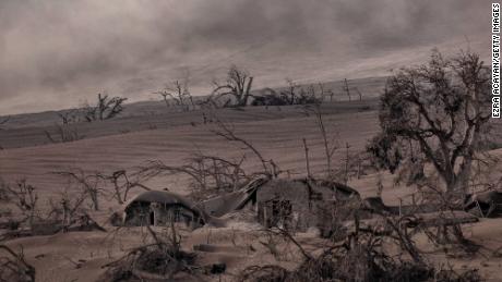 Houses near Taal Volcano&#39;s crater are seen buried in volcanic ash from the eruption.