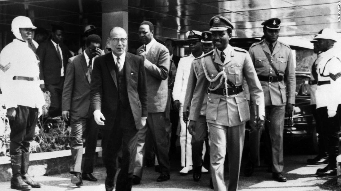 Gen. Yakubu Gowon, right, welcomes UN Secretary-General U Thant, left, as he arrives in Lagos to hold talks about the refugee crisis in the aftermath of the Biafran conflict on January 19, 1970.