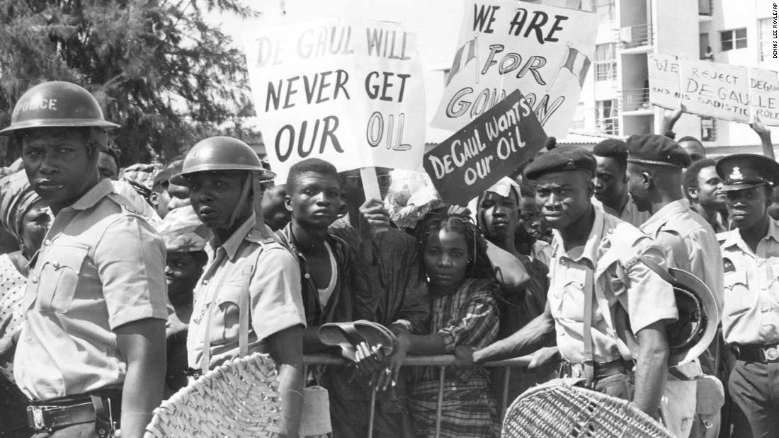 Nigerian police push back crowds of demonstrators outside the French Embassy in Lagos on September 16, 1968. An estimated 2,000 demonstrators presented the French ambassador with a letter protesting French assistance to Biafra. France provided weapons and mercenary fighters to Biafra and promoted their cause internationally, describing the situation as a genocide. &lt;br /&gt;