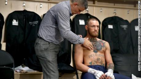 McGregor warms up in his locker room prior to his super welterweight boxing match against Floyd Mayweather Jr.