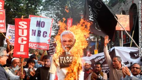 Activists of the Social Unity Center of India (SUCI) burn an effigy of India&#39;s Prime Minister Narendra Modi as they participate in a protest against India&#39;s new citizenship law, in Kolkata on January 11, 2020. 