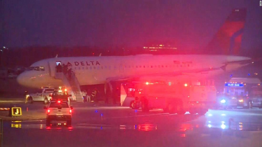 A Delta flight slid off a taxiway at Kansas City International Airport ...