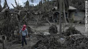 Philippine volcano: Authorities evacuate thousands as Taal spews mile ...