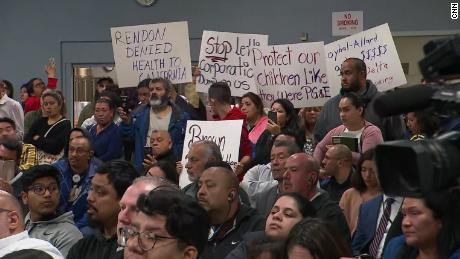 Members of the Cudahy, California community meet at a town hall over jet fuel dump.