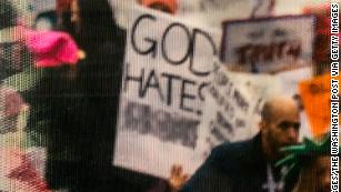 A close up on the altered sign in the photograph from Women&#39;s March in 2017 is seen on display at the National Archives Research Center on Friday, January 17, 2020 in Washington, DC.