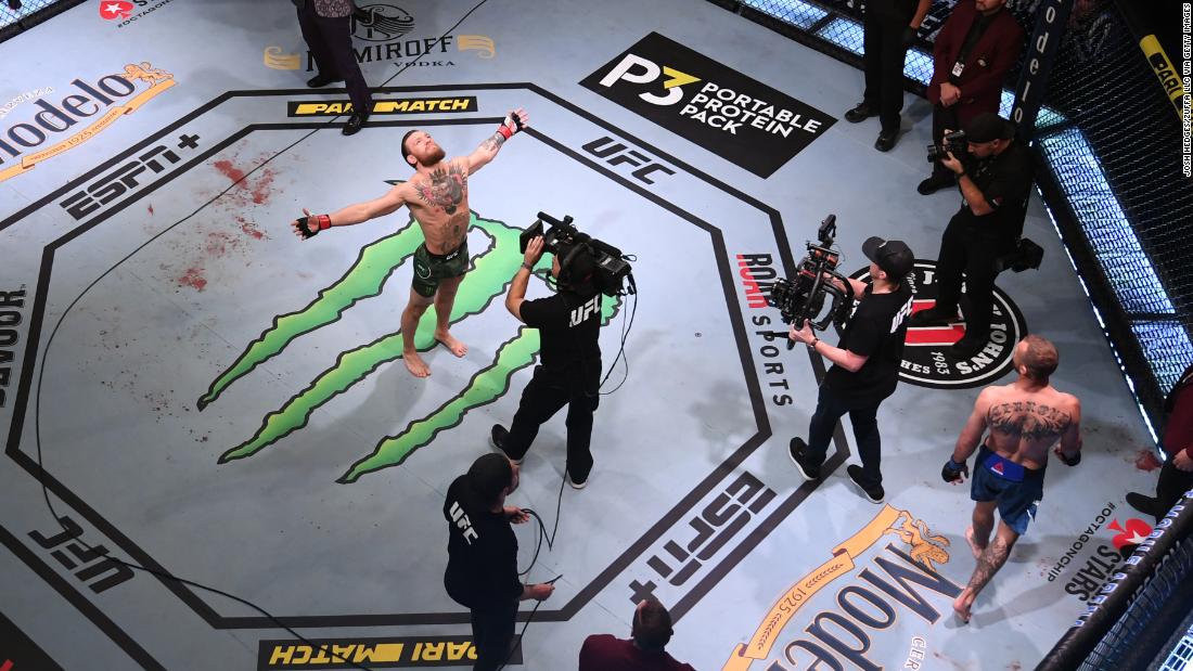 McGregor celebrates after defeating Cerrone. McGregor improves his career professional record to 22-4 with 19 knockouts.