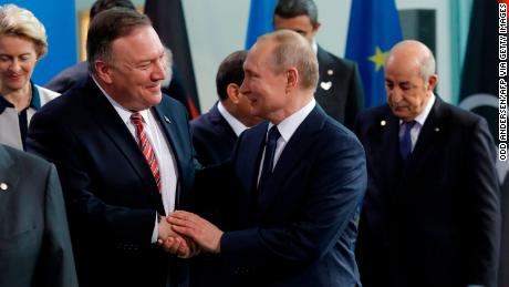 US Secretary of State Mike Pompeo, left, with Russian President Vladimir Putin in Berlin on Sunday. 