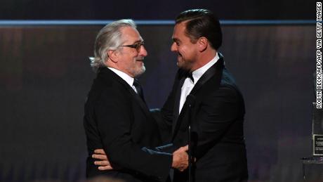 Leonardo DiCaprio (R) presents Robert De Niro the SAG Life Achievment Award (Photo by Robyn Beck / AFP) (Photo by ROBYN BECK/AFP via Getty Images)