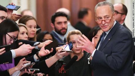 US Senate Minority Leader Chuck Schumer (D-NY) speaks to reporters during the first day of the Senate impeachment trial.