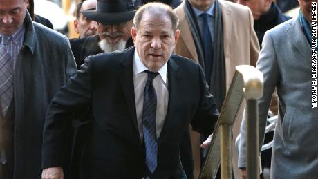 Harvey Weinstein is helped as he arrives at the Manhattan Criminal Court, on January 22, 2020, for opening arguments in his trial in New York.