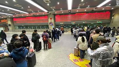 People in a ticket line trying to get out of Wuhan in Wuchang train station in China.