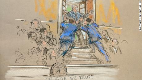 A protestor briefly interrupts the trial on January 22. 