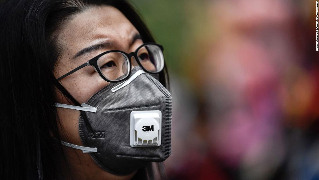 People in Guangzhou, China, wear protective masks on January 22, 2020.