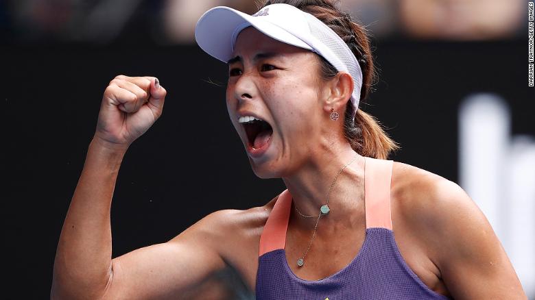 Qiang Wang of China celebrates after winning a point.